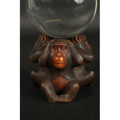 84 - A VERY FINE JAPANESE CARVED WOOD OKIMONO OF THREE WISE MONKEYS WITH GLASS BALL, in the manner of Mas... 