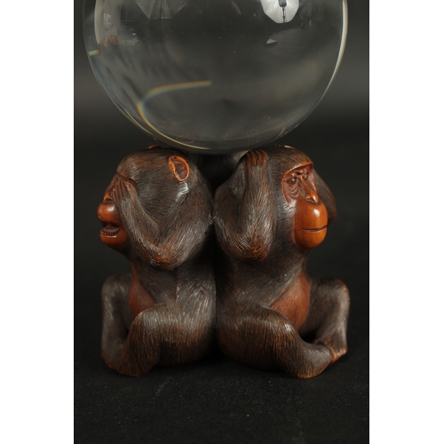 84 - A VERY FINE JAPANESE CARVED WOOD OKIMONO OF THREE WISE MONKEYS WITH GLASS BALL, in the manner of Mas... 