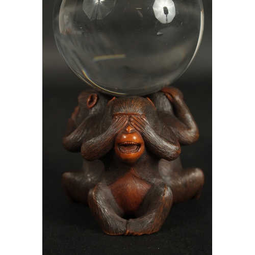 84 - A VERY FINE JAPANESE CARVED WOOD OKIMONO OF THREE WISE MONKEYS WITH GLASS BALL, in the manner of Mas... 