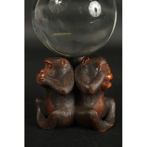 84 - A VERY FINE JAPANESE CARVED WOOD OKIMONO OF THREE WISE MONKEYS WITH GLASS BALL, in the manner of Mas... 