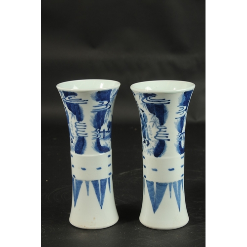 98 - A PAIR OF CHINESE BLUE AND WHITE PORCELAIN GU SHAPE VASES, decorated with figures, 21cm high.