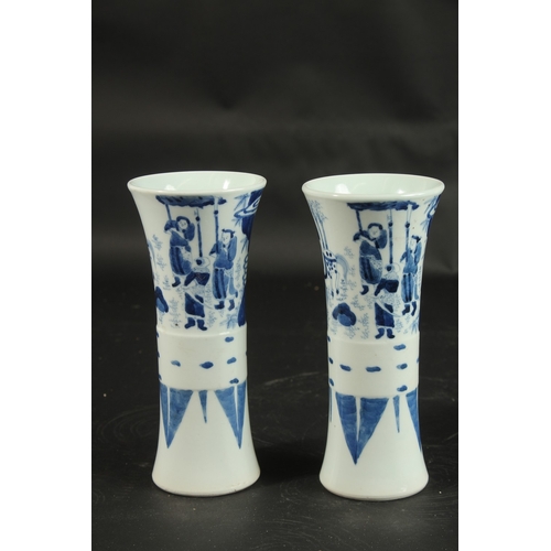 98 - A PAIR OF CHINESE BLUE AND WHITE PORCELAIN GU SHAPE VASES, decorated with figures, 21cm high.