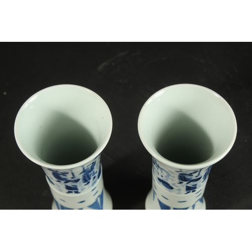 98 - A PAIR OF CHINESE BLUE AND WHITE PORCELAIN GU SHAPE VASES, decorated with figures, 21cm high.