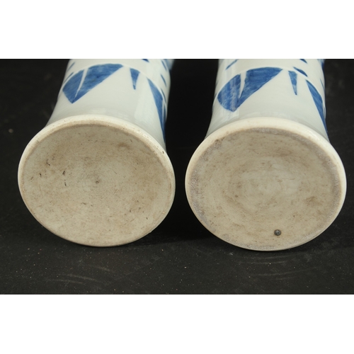 98 - A PAIR OF CHINESE BLUE AND WHITE PORCELAIN GU SHAPE VASES, decorated with figures, 21cm high.