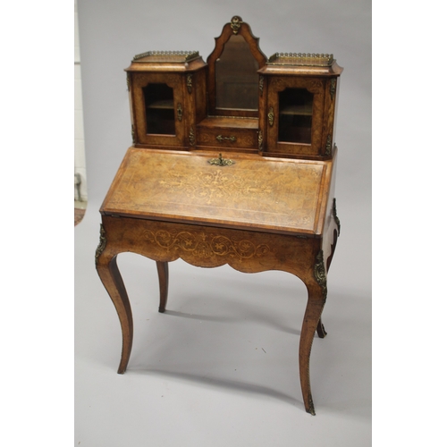 516 - A GOOD VICTORIAN FIGURED WALNUT INLAID BONHEUR DU JOUR WITH MIRROR, the top with brass grill, two gl... 