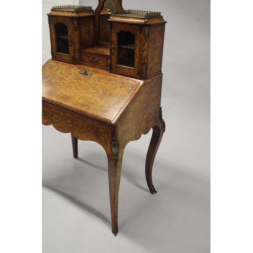 516 - A GOOD VICTORIAN FIGURED WALNUT INLAID BONHEUR DU JOUR WITH MIRROR, the top with brass grill, two gl... 