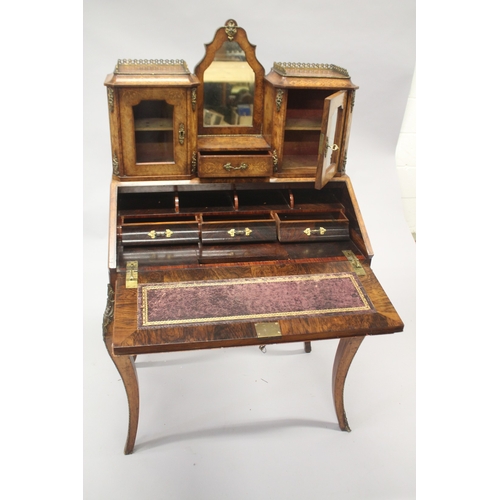 516 - A GOOD VICTORIAN FIGURED WALNUT INLAID BONHEUR DU JOUR WITH MIRROR, the top with brass grill, two gl... 