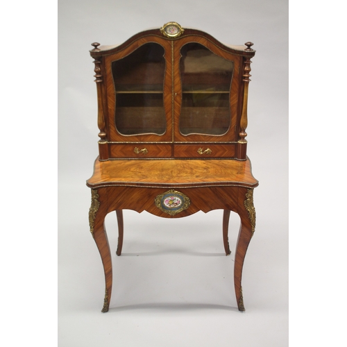 517 - A GOOD 19TH CENTURY KINGWOOD AND WALNUT BONHEUR-DU-JOUR, the serpentine shaped top with a pair of gl... 