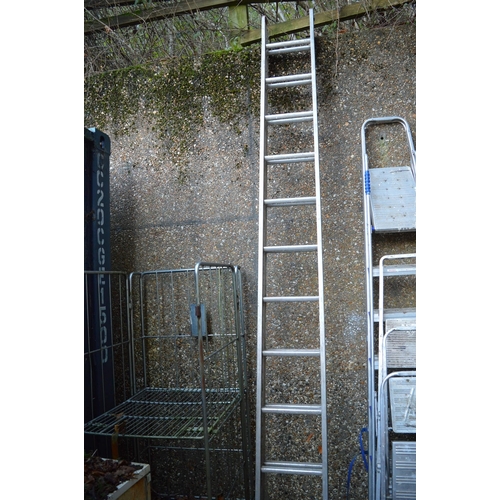 13 - An aluminium two section ladder.