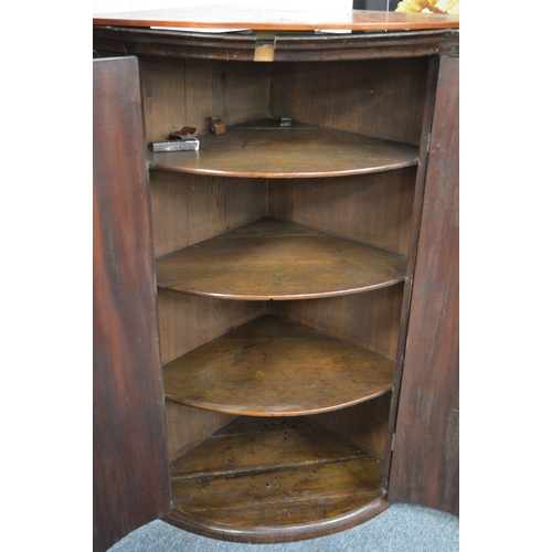 182 - A 19th century mahogany hanging corner cupboard.