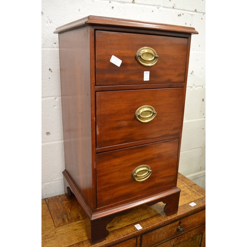 193 - A pair of mahogany three drawer pedestal chests.