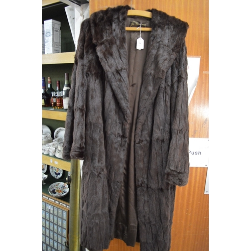 21 - A ladies fur coat.