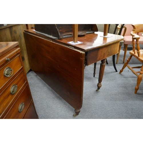 220 - A 19th century mahogany single drop-flap dining table on turned and reeded legs.