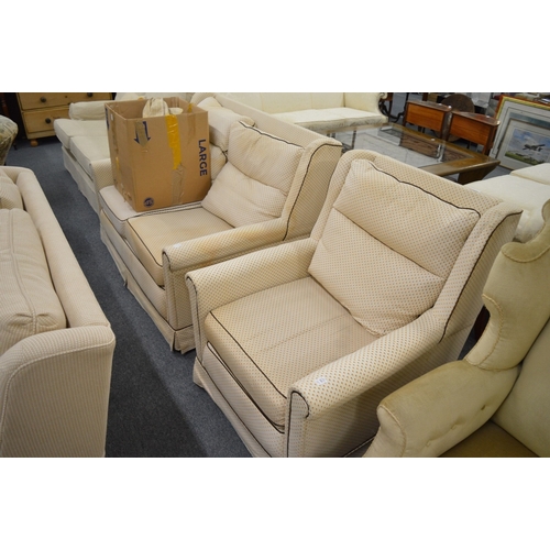 245 - A two seater settee and matching armchair together with  a set of extra loose covers.