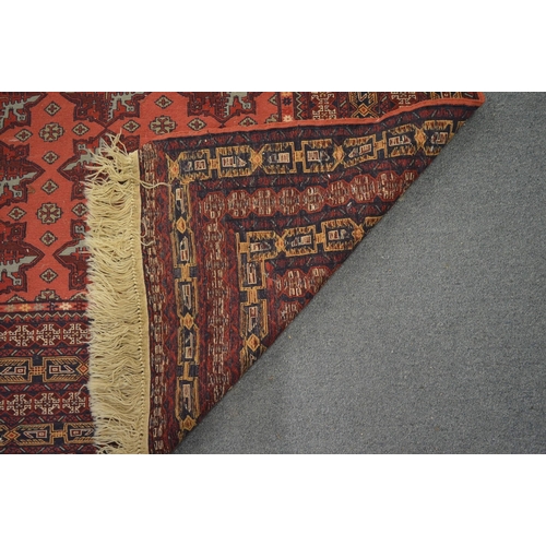 286 - A Persian Bokhara style rug, 177cm x 127cm.