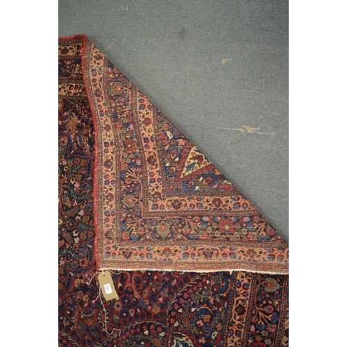 287 - A good Persian rug with floral decoration, 202cm x 139cm.