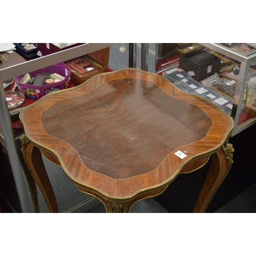 288 - A French style king wood and ormolu shaped top centre table.