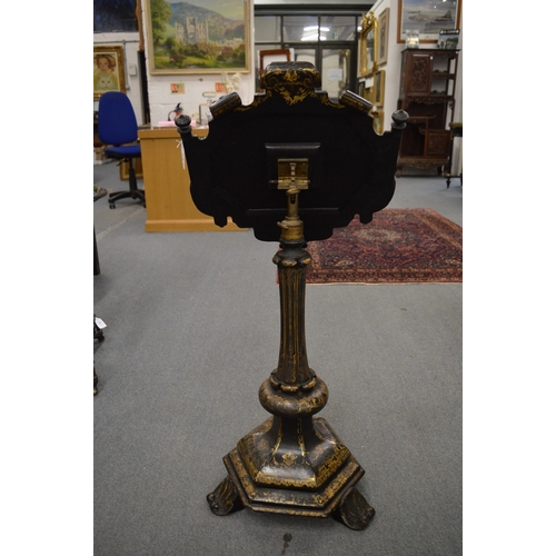 304 - A good Victorian papier mache and gilt decorated adjustable music or reading stand, the top painted ... 