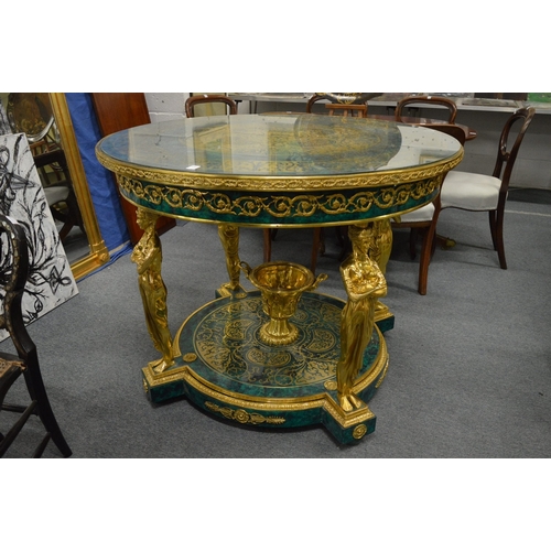 308 - An impressive faux malachite and ormolu circular two-tier centre table with figural supports.