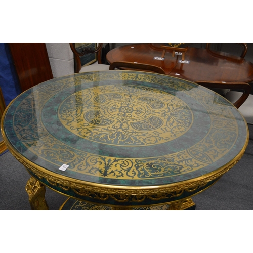 308 - An impressive faux malachite and ormolu circular two-tier centre table with figural supports.