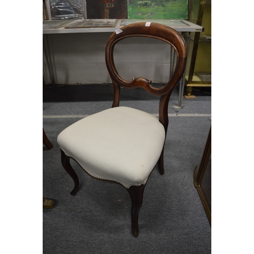 310 - A matched set of six Victorian mahogany balloon back dining chairs.