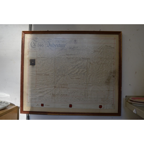 33 - A framed and glazed indenture.