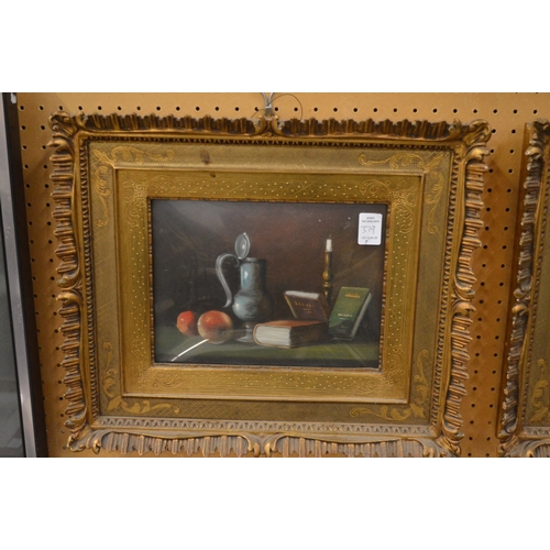 379 - Still life of books and a vase together with another similar, both in decorative gilt frames.