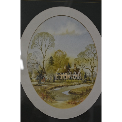 387 - Andrew Findlay, a pair of oval watercolour scenes of houses in a landscape, signed.