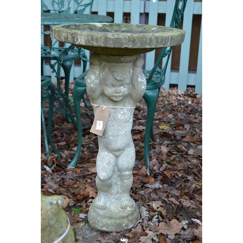 4 - A reconstituted bird bath, the support modelled as a cherub.