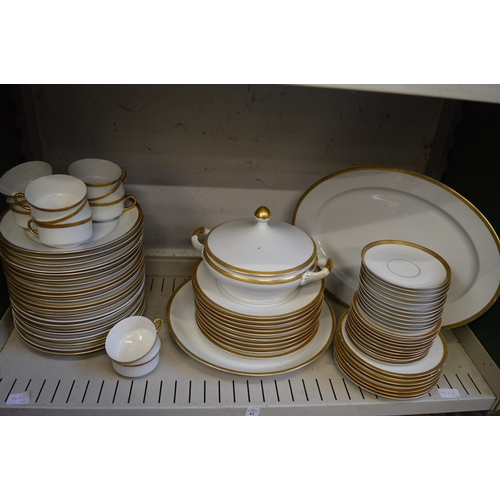 42 - A quantity of Bavarian porcelain dinnerware with gilded rims.