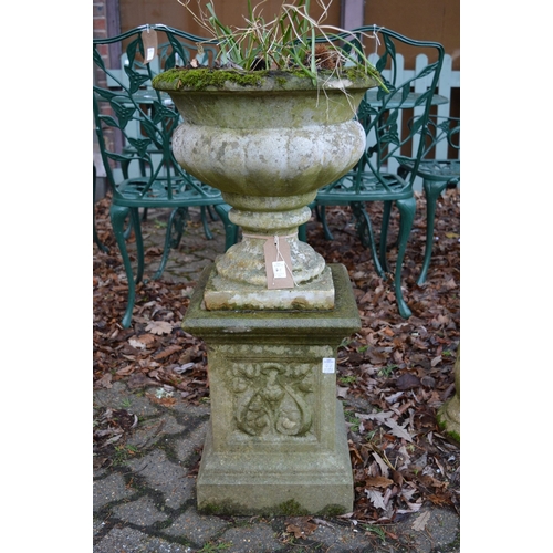 4A - A reconstituted stone urn on pedestal base.