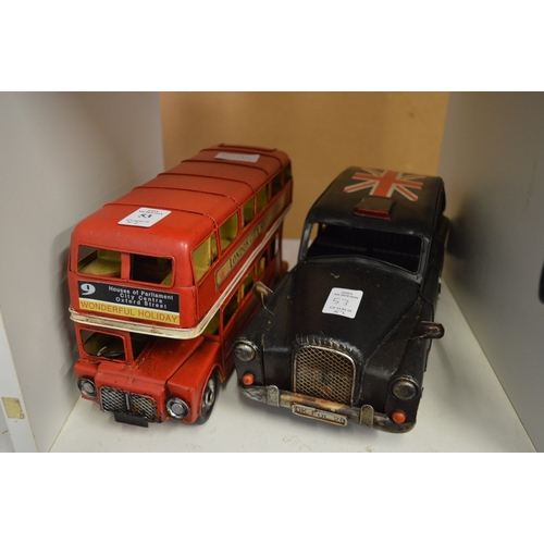 53 - Tin plate model of a London bus and a London taxi.