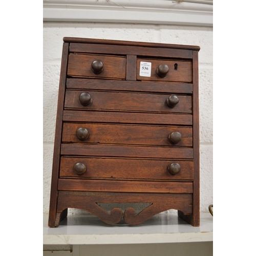 536 - A small table top mahogany chest of drawers.