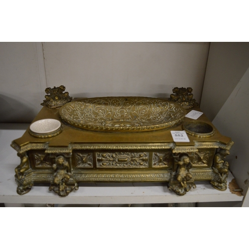 552 - A good decorative cast brass table stand.