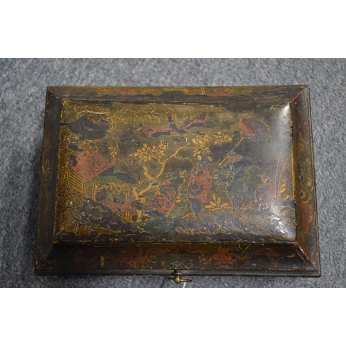 563 - A 19th century chinoiserie decorated lacquer casket and cover and two other boxes.