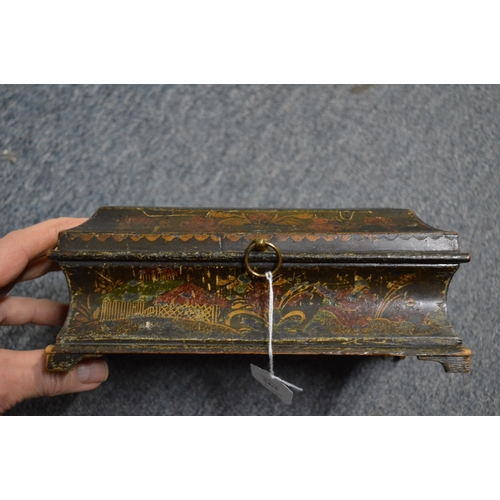 563 - A 19th century chinoiserie decorated lacquer casket and cover and two other boxes.