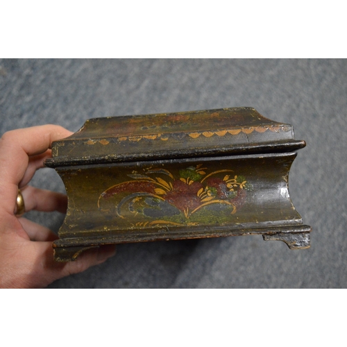 563 - A 19th century chinoiserie decorated lacquer casket and cover and two other boxes.