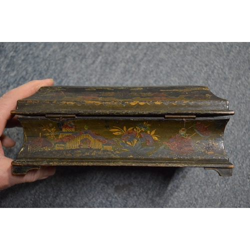 563 - A 19th century chinoiserie decorated lacquer casket and cover and two other boxes.