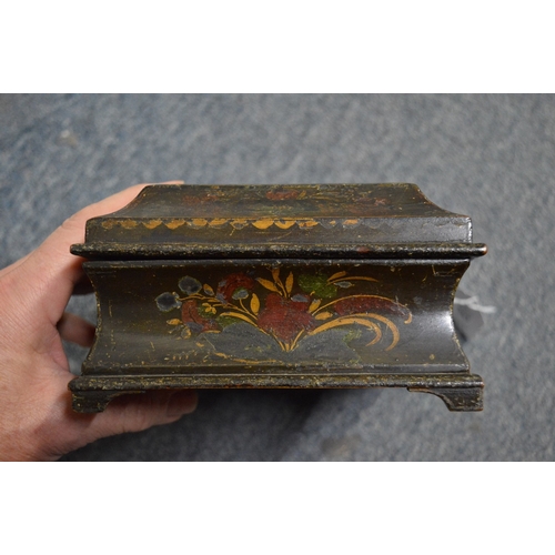 563 - A 19th century chinoiserie decorated lacquer casket and cover and two other boxes.