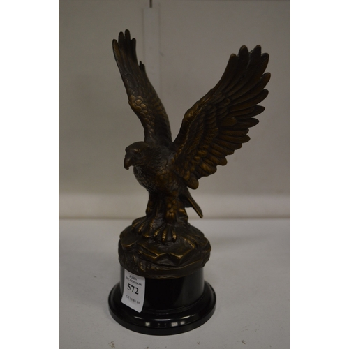 572 - A cast bronze figure of a eagle with wings out swept.