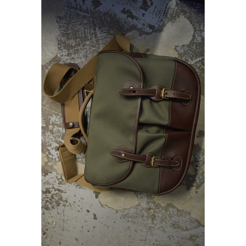 59C - A leather and canvas holdall.