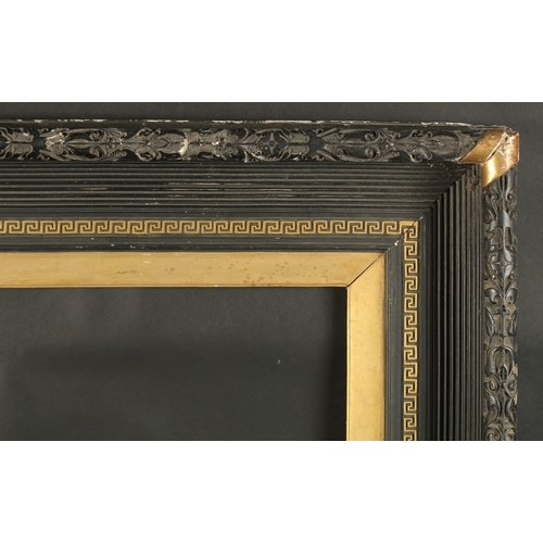 13 - A BLACK REEDED FRAME with Greek key pattern. Rebate size 20ins x 27ins.