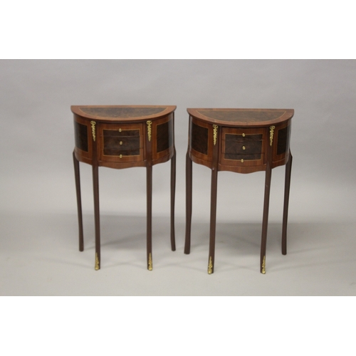 501 - A PAIR OF LOUIS XVITH STYLE HALF MOON SIDE TABLES with cross-banded tops, three small drawers on sle... 