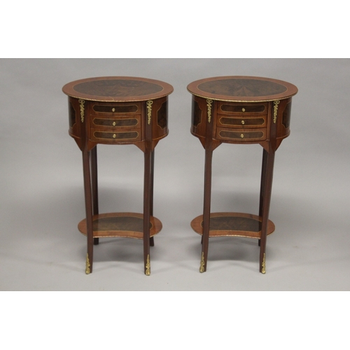 502 - A PAIR OF LOUIS XVITH STYLE OVAL SIDE TABLES with cross-banded tops, three small drawers on slender ... 