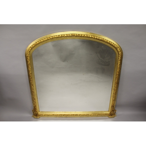 511 - A GILTWOOD SHAPED TOP OVERMANTLE MIRROR. 4ft 7ins high x 4ft 5ins wide.