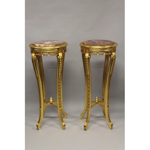 512 - A GOOD PAIR OF CIRCULAR MARBLE TOP STANDS. 3ft 7ins high x 1ft 6ins wide.