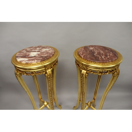 512 - A GOOD PAIR OF CIRCULAR MARBLE TOP STANDS. 3ft 7ins high x 1ft 6ins wide.