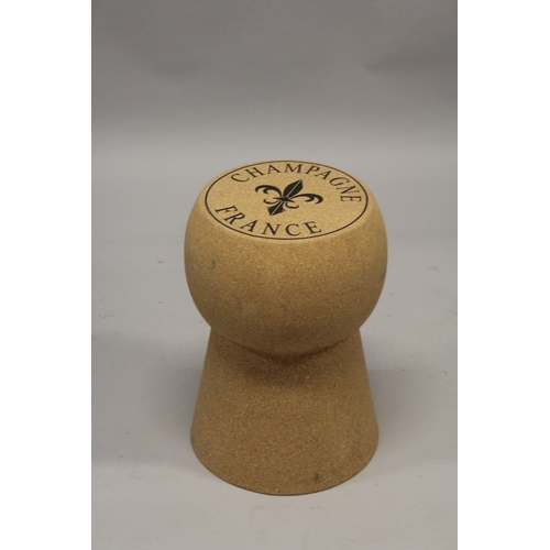 517 - A CORK AND METAL CHAMPAGNE STOOL.