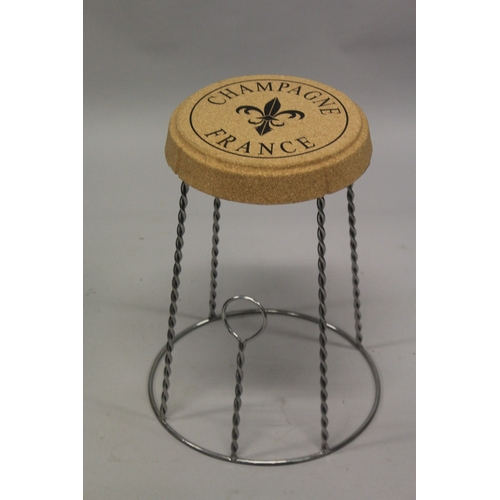 518 - A CORK AND METAL CHAMPAGNE STOOL.