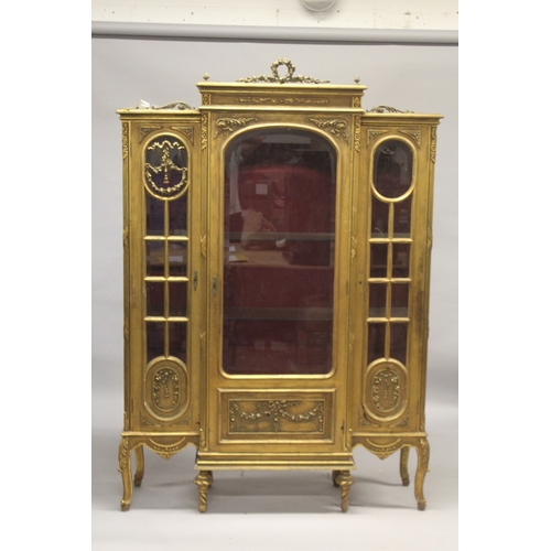 520 - A LARGE GILTWOOD BREAKFRONT STANDING CUPBOARD with large central glass panel door, doors to the side... 